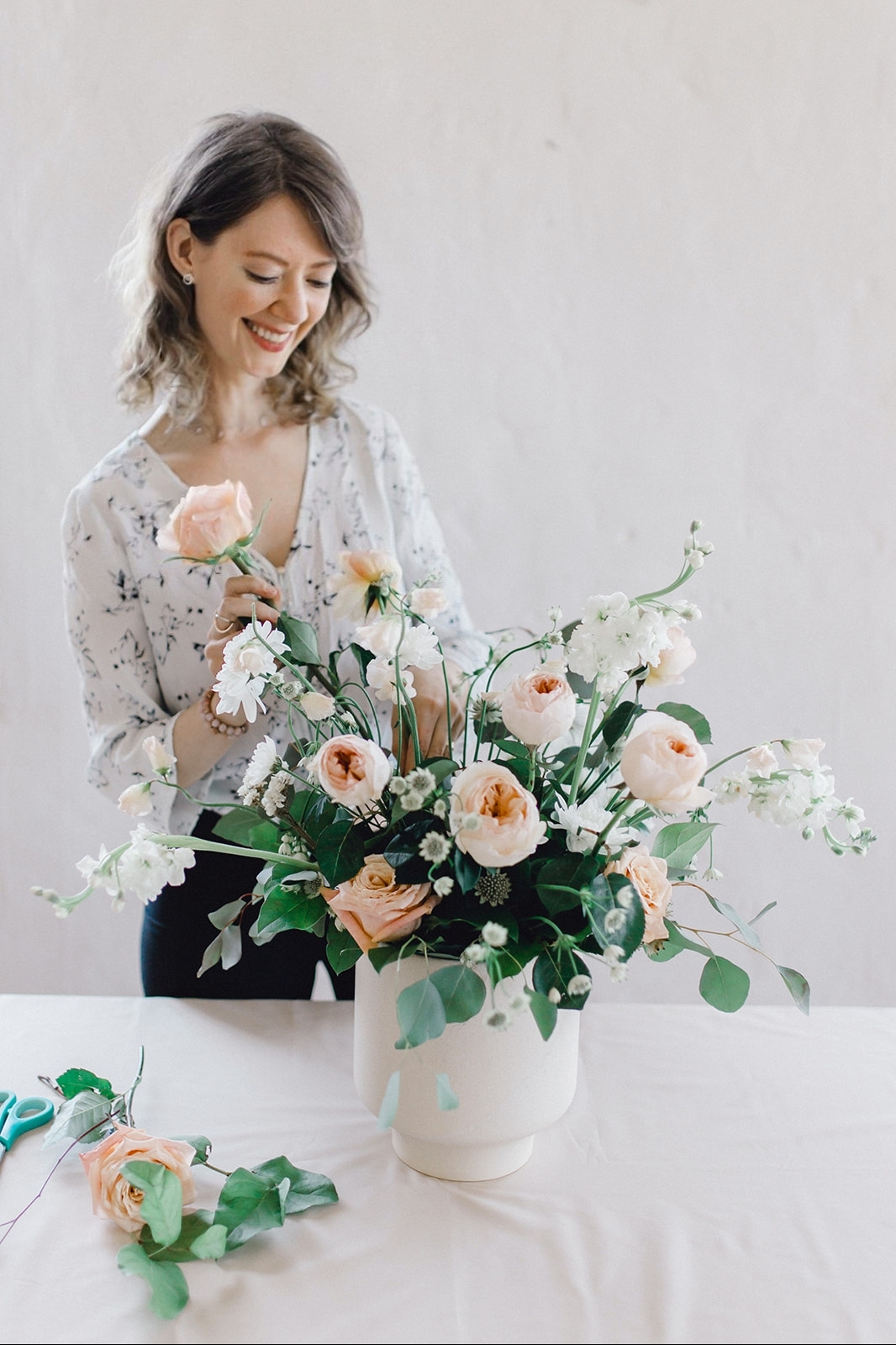 kitchener florist irene designing a floral arrangement