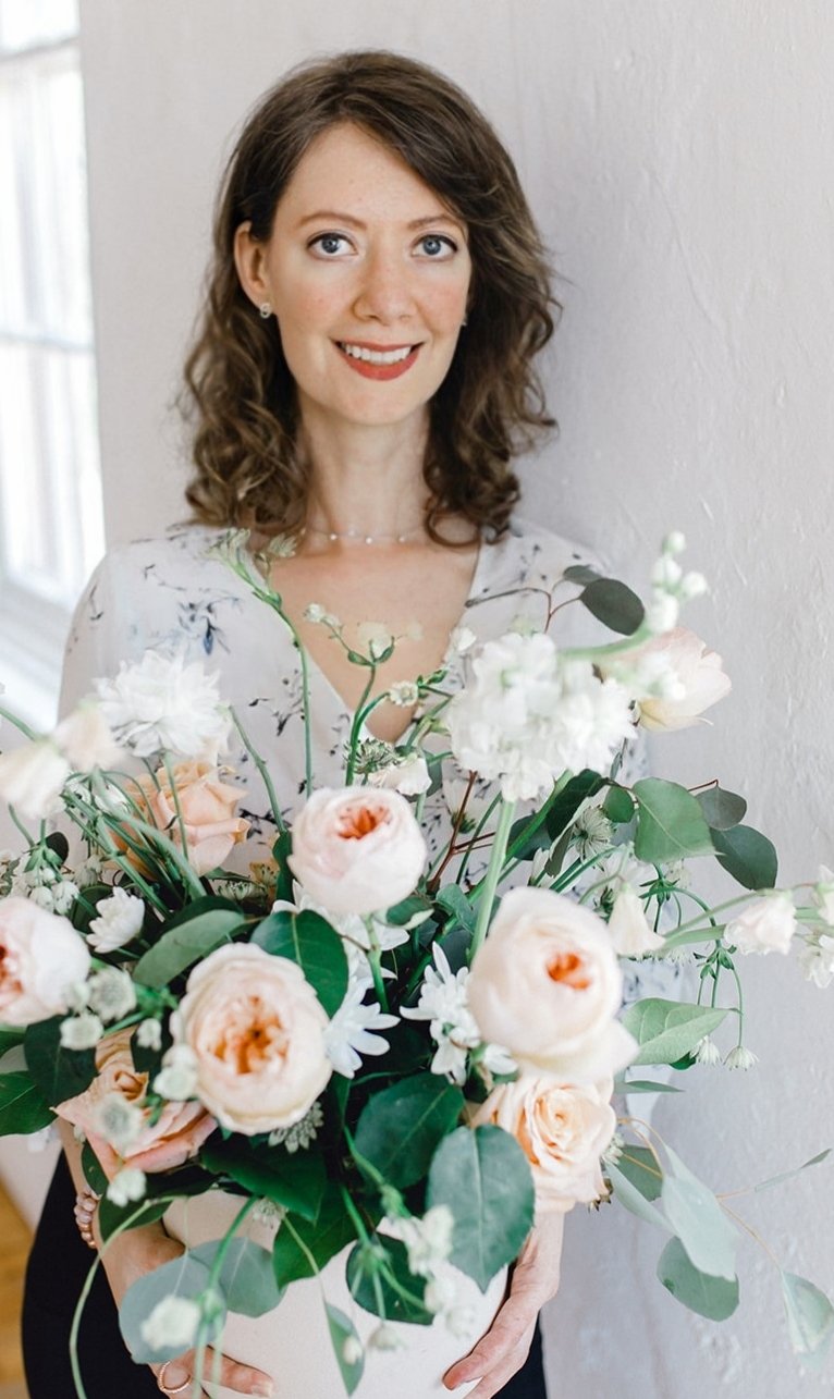 Kitchener wedding florist Irene holding a bouquet of flowers