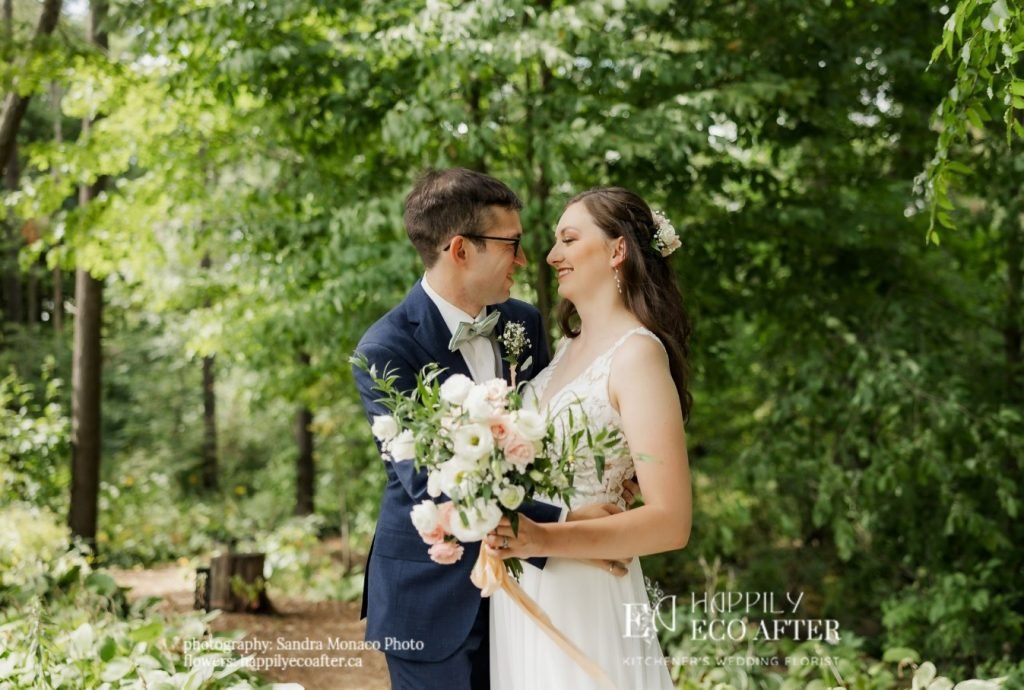 wedding flowers newlyweds in Drumbo ontario, looking into each others eyes.