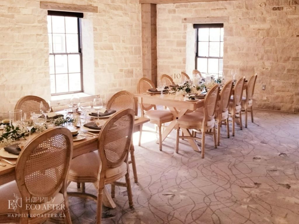 guest tables with rustic stone facade