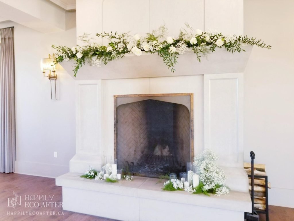 large fireplace with florals adorning the mantle