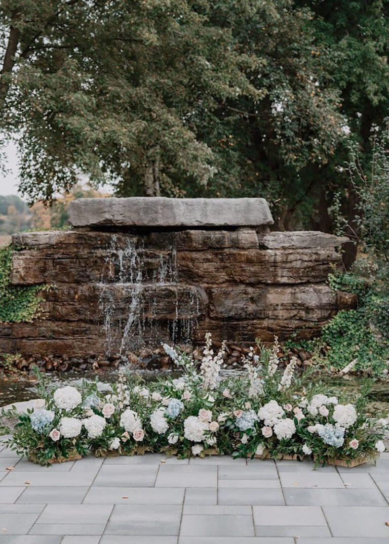 ground arch in front of a waerfall