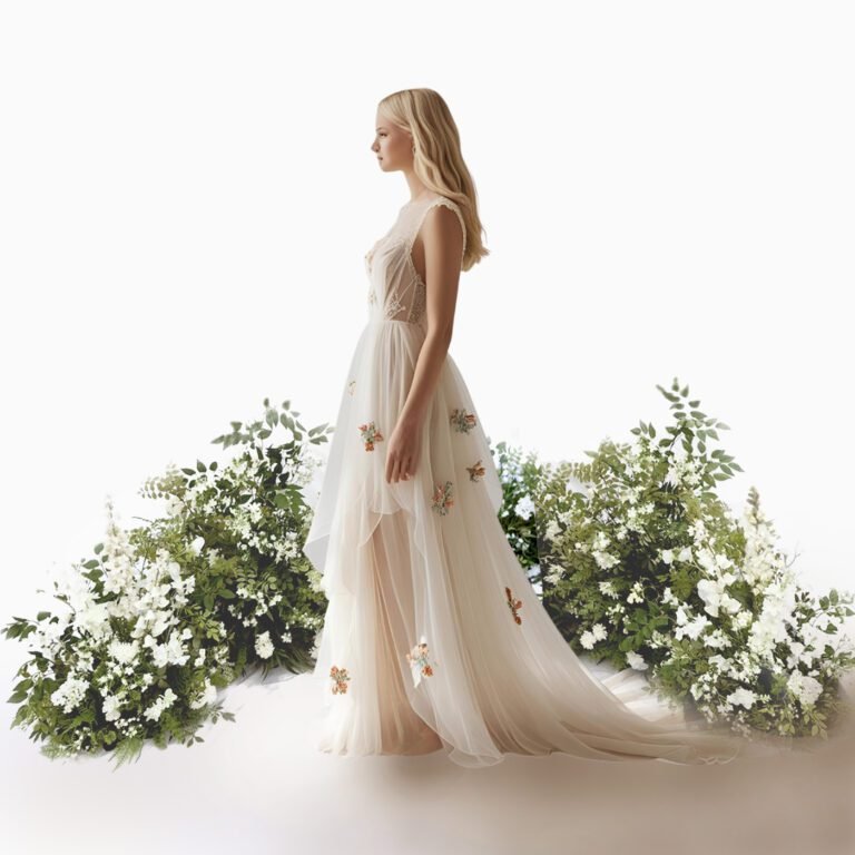 bride standing in front of a floral ground arch looking to the side